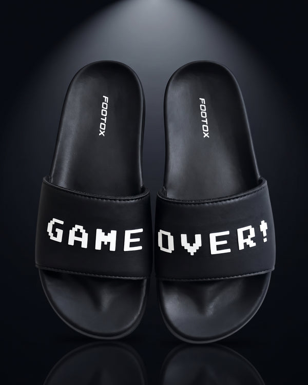 Front view of FOOTOX Game Over black slides for men – soft sole gamer chappal Pakistan