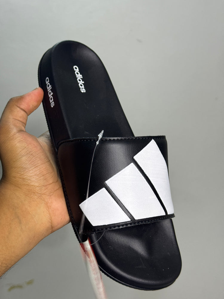 Black-and-white geometric strap slides shown from the side