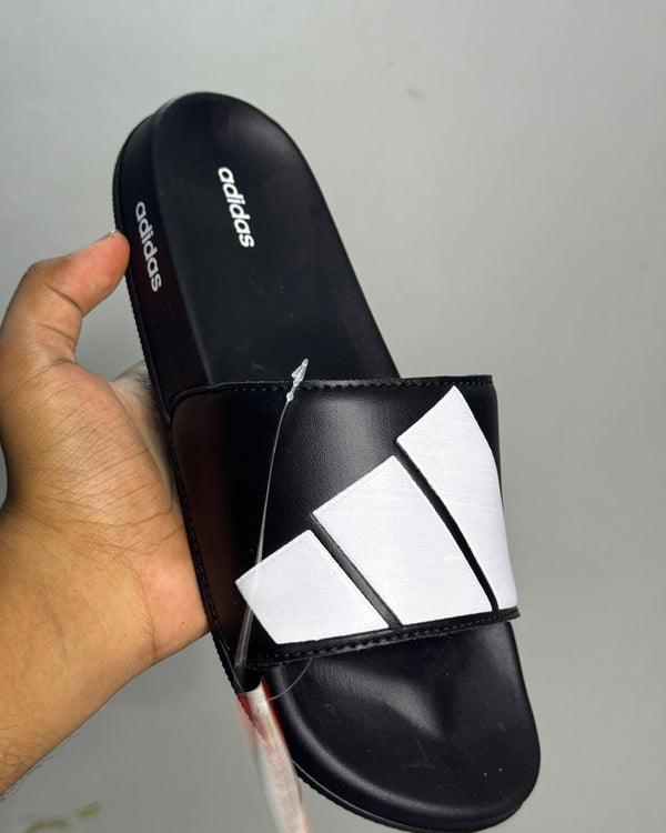 Black-and-white geometric strap slides shown from the side
