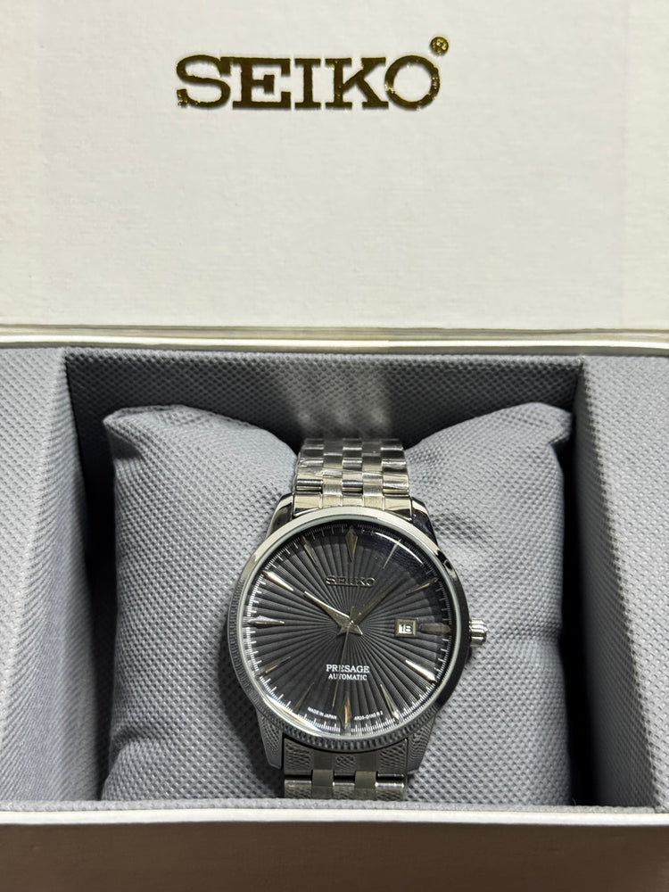 Silver Seiko Presage semi-automatic watch with dark textured dial and date display