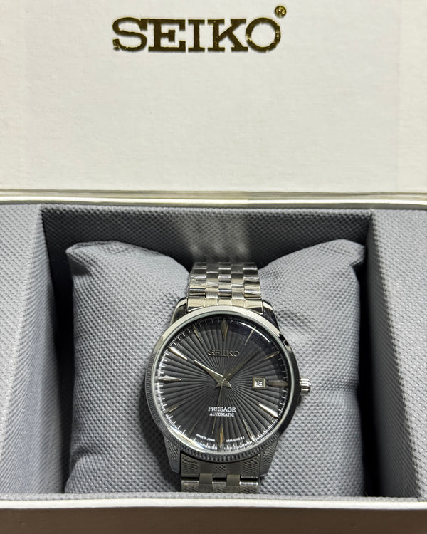 Silver Seiko Presage semi-automatic watch with dark textured dial and date display