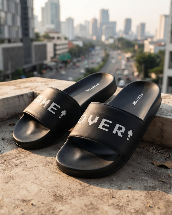 FOOTOX Game Over men's black slides showing FOOTOX logo on the footbed